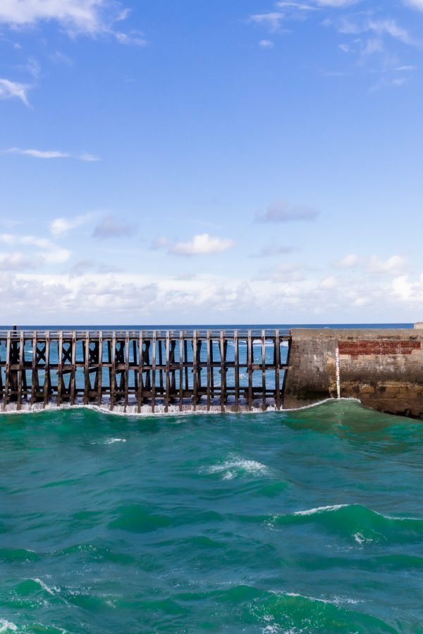 Lighthouses and guidance at the entrance of the Port of Fecamp, Normandy, France, Europe on the coast of Normandy in the English Channel in Autumn. Seascape in the day time.